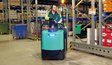 Operator driving Mitsubishi center control rider with light on